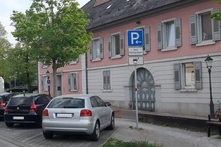 Parking Only With Parking Ticket, But Electric Cars Free
